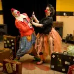 Meaning of Acting and Actor for Primary 5 1 Meaning of Acting and Actor: Clowns performing indoors with vibrant costumes and stage props, capturing joyful fun.