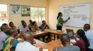 10 Practical School Management Tips for Nigerian School Heads & Owners 5 School head presenting a structured school improvement plan to staff in a training session.